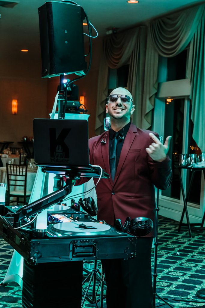 Image of DJ Kibar Moussoba behind his DJ booth.